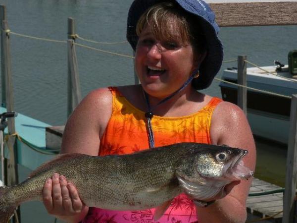 Woman holding a walleye perch