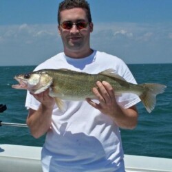 man with fish catch