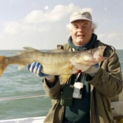 man with fish catch