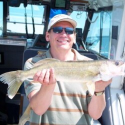 man with fish catch